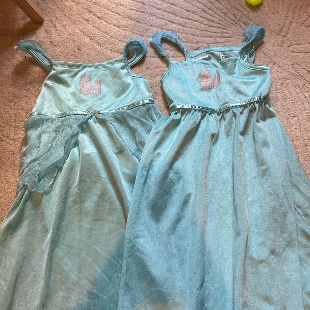 2 Disney castle nightgowns.  One has a little skirt.  Both 2t-3T.